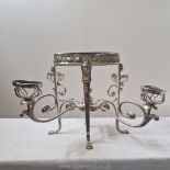 A spectacular early Victorian silver plated centrepiece standing on Egyptian style sphinx supports,