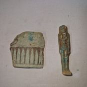 An Egyptian u shabti (possibly ancient 3" high) and a very early fragment of Islamic pottery.