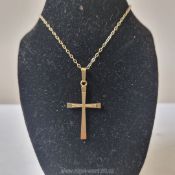 A 20th century 9 carat gold crucifix on a 9 carat gold chain (maker's mark GS) and another 9 carat