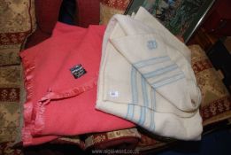 Two Witney Wool blankets, one pink, one cream.
