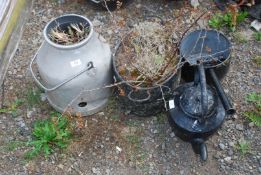 A black painted kettle, cook pot, saucepan, and an aluminium dump bucket.