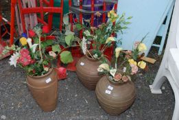 Three vases with artificial flowers, 15" and 12" high.