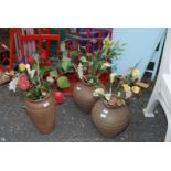 Three vases with artificial flowers, 15" and 12" high.