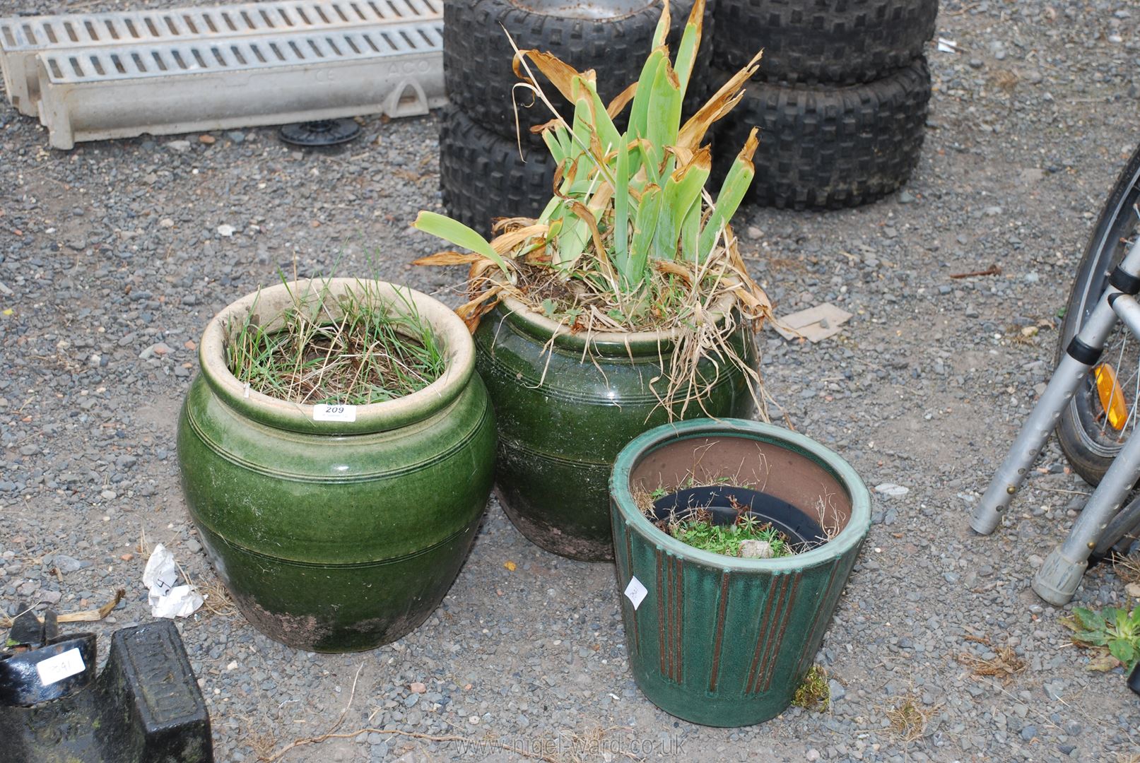 Three glazed green planters.