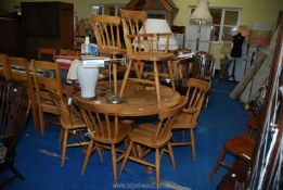 A round table and six chairs, two being carvers.