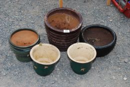 Five glazed flower pots.