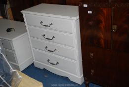 A white four drawer chest of drawers 34" wide x 16 deep x 3' high.