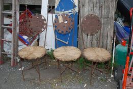 Three metal high back chairs with seagrass seats, 42 1/2" high.