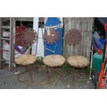 Three metal high back chairs with seagrass seats, 42 1/2" high.