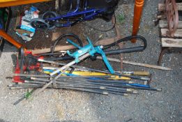 A quantity of drainage rods, drill stand, pick axe, level, etc.