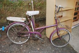A Raleigh Shopper bicycle.
