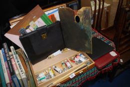 An Art box, brushes and paints.