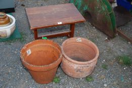 A small table and two garden planters.
