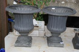 A pair of attractive contemporary garden planters/urns having fluted and reeded design and of