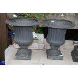 A pair of attractive contemporary garden planters/urns having fluted and reeded design and of