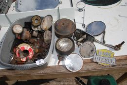 A bowl of vintage car parts, gauges, BMC diesel badge.