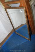 A large gilt framed mirror 38 1/2" x 26 1/2".