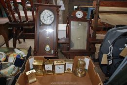 A quantity of miscellanea including carriage clocks, a wall clock and a mirror with a clock.