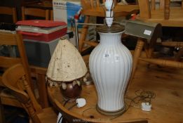 Two table lamps, one having a copper base.