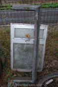 A small aluminium cased window and a fire surround.