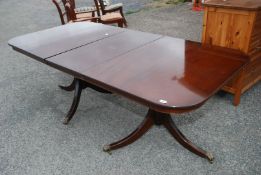 A Reproduction round end Dining Table with extension leaf.