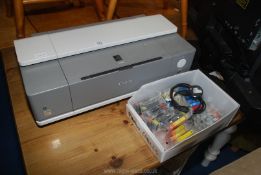 A Canon Pixma iX4000 A3 printer with box of 26 new cartridges, working.