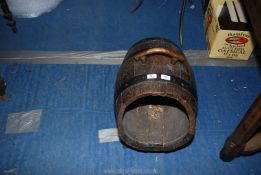 A copper handled log barrel.