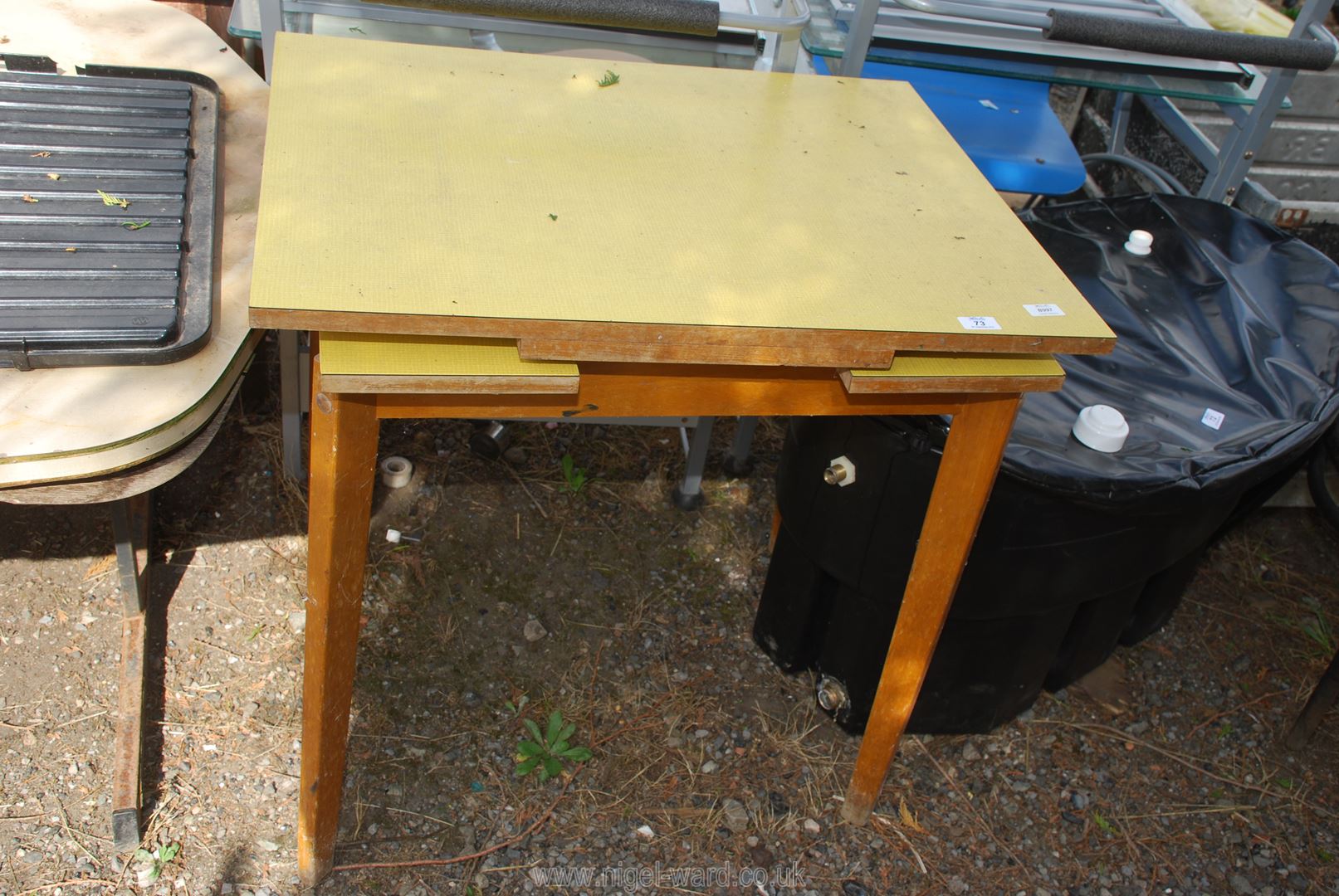 An extendable Formica topped kitchen table.