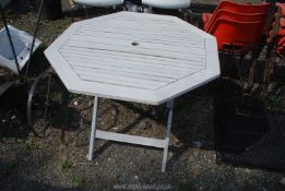 An octagonal outdoor table, 3' diameter x 29" high.