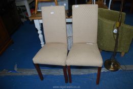 Two high back dining chairs.