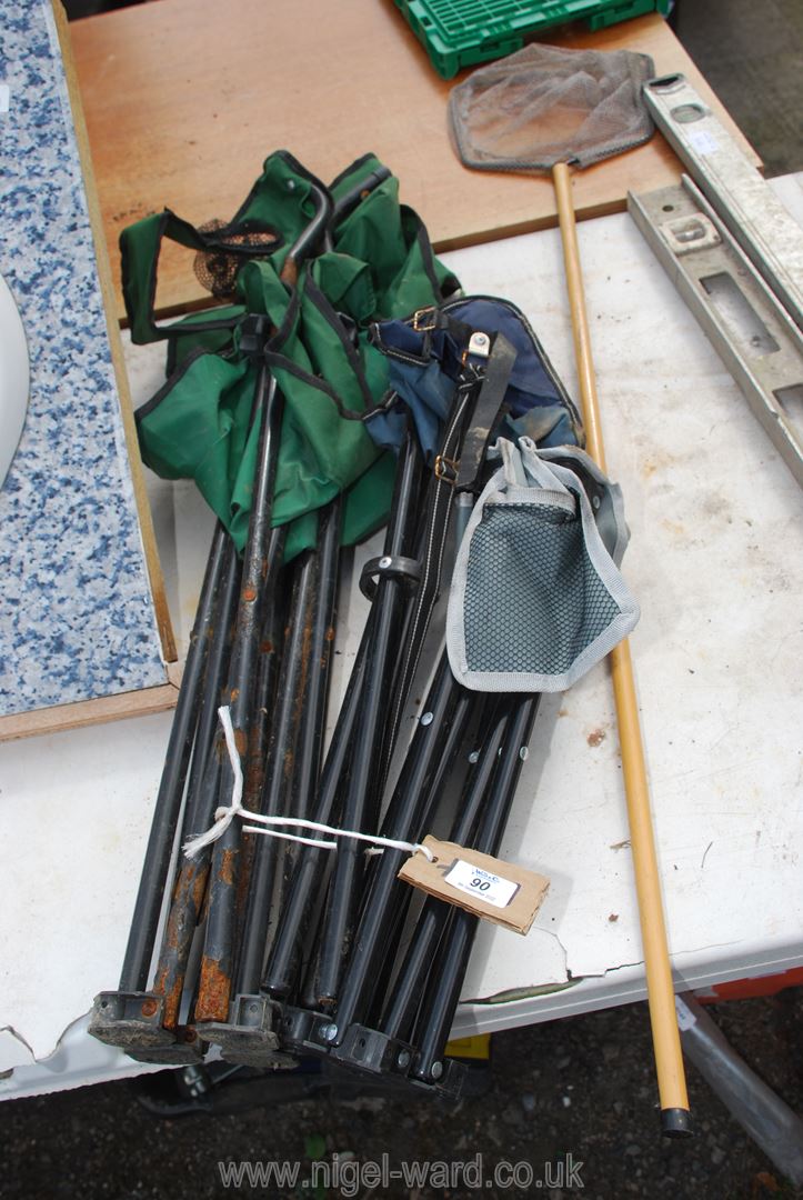 Two camping stools, camping chair and fishing net.