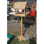 A wooden bird table.