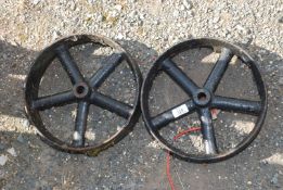 A pair of hen house wheels, 11 3/4" diameter x 3" width.