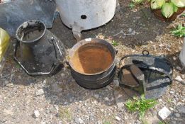 A shoe last, cauldron, dump bucket and two swinging griddle pans.
