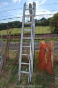 A three section extension aluminium ladder.