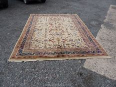 A large traditional rug 135" x 101".