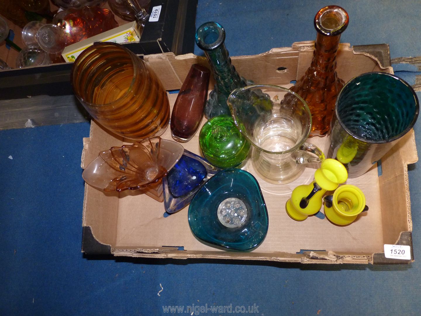 A quantity of coloured glass to include a pair of neon yellow vases, Italian made bottle vases,