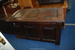 A peg joyned Oak Blanket Chest having three raised and fielded panels to the front,