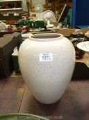 A large stone coloured T.G. Green vase, 10" high x 8" diameter approx.