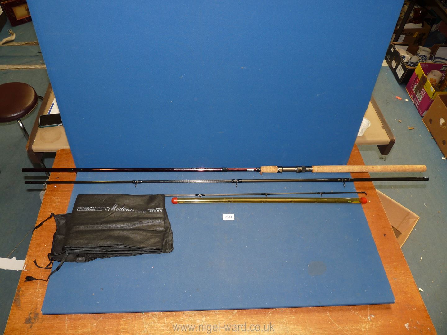A 12' Moderna Feeder four-section carbon fibre fishing rod, with spare tips.