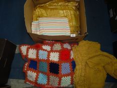 A quantity of textiles including crochet, small yellow crochet tablecloth,