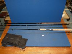A 9' 6" Spinning Advantage Masterline two-section carbon fibre fishing rod with cork handle,