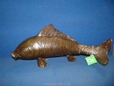 A large ornamental bronzed effect figure of a Koi Carp fish, 11" high x 23" long.