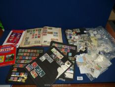 A Victory stamp album containing English and mixed foreign stamps and loose stamps.