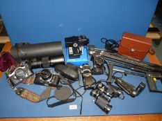 A quantity of cameras and accessories including tripod stands, flash gun, Pentax Asahi camera,