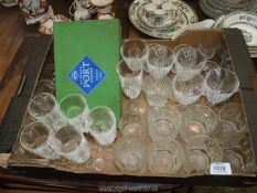 A large quantity of glasses including a boxed set of 4 port glasses, tumblers, brandy balloons etc.
