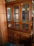 A Mahogany continental design Cabinet on Cupboard,