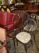 A set of four Wheelback Dining Chairs including one carver
