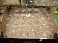 A quantity of glasses including six champagne flutes, four brandy, six red and six white wine,
