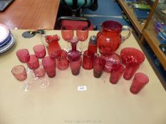 A quantity of cranberry glass to include; small tumblers, wine glasses, sugar sifter,